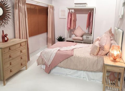 Mineral Blush curtains in a soft pink over Brushed Copper metal Venetian blinds in bedroom