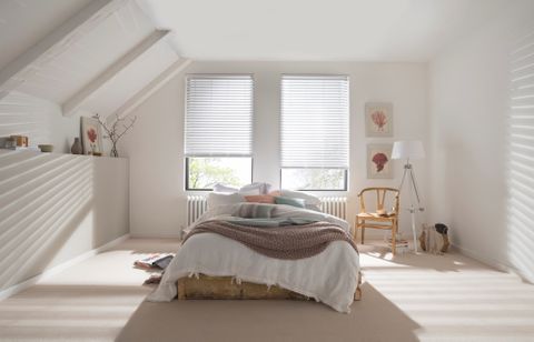 White Wooden blinds in bedroom