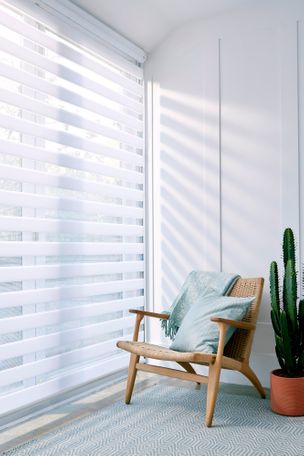 white day night blinds hanging on doors of rest room