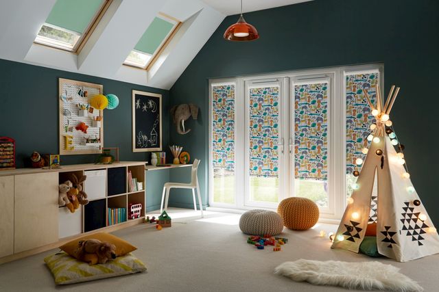 jungle book safari printed roller blinds installed on windows of children play and study room