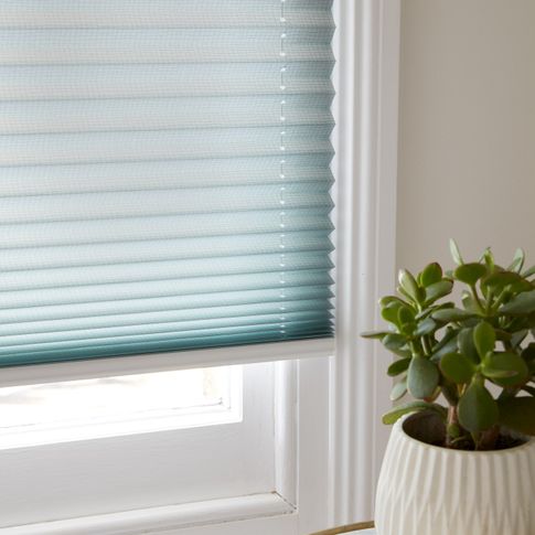 Close up of light blue Pleated blinds.