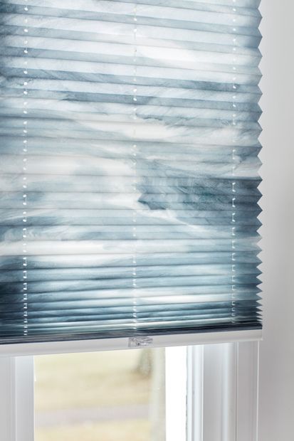 Close up of blue white ripple effect Pleated blinds.