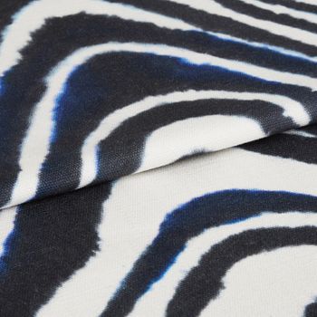 Kovu batik fabric swatch featuring zebra line print on dark blue background