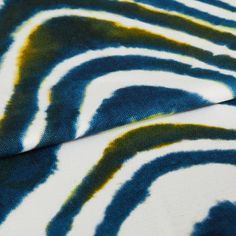 Kovu mirage fabric swatch featuring zebra print on blue and yellow background