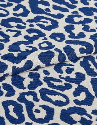 Wild cobalt fabric swatch featuring blue leopard print on white background