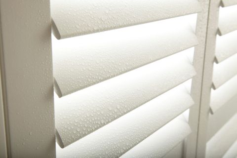 close up of white waterproof shutters with water drops