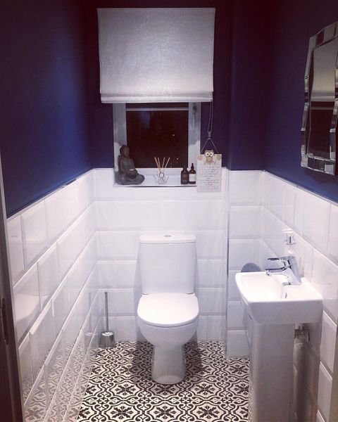 White roman blinds dressed on window of bathroom