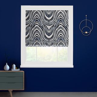 a roller blind with a repeating black and white swirled pattern