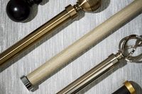 metal and wooden curtain poles