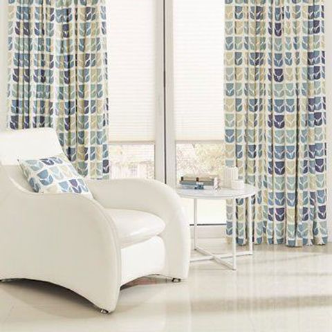 Lightly furnished living room with Rayna Aqua curtains and Portabello White pleated blinds