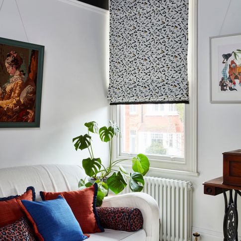 Serra Ochre Roman blinds in vibrant living room