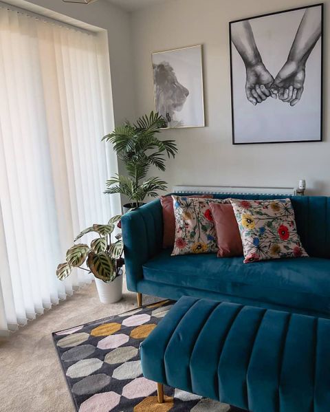 Florence white vertical blinds with teal velvet sofa and floral cushions