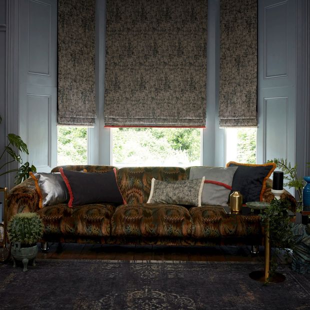 garcia phantom roman blinds with colette amour fringing  in dark living room