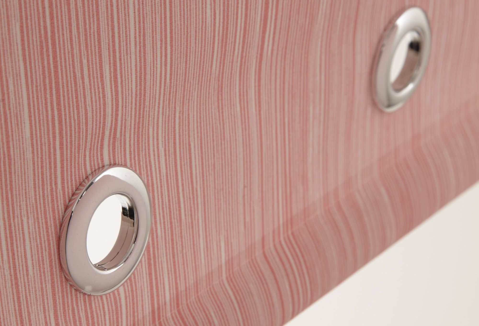 a roller blind with fine red and white stripes has eyelets installed in the material