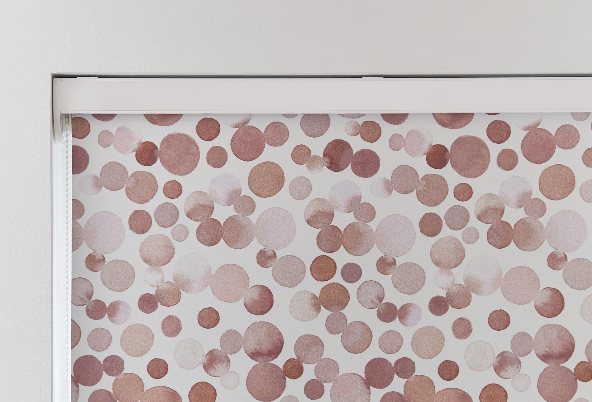 A roller blind cassette fitted to a window 