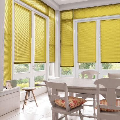Yellow Portfolio Marigold Venetian blinds hanging in conservatory windows