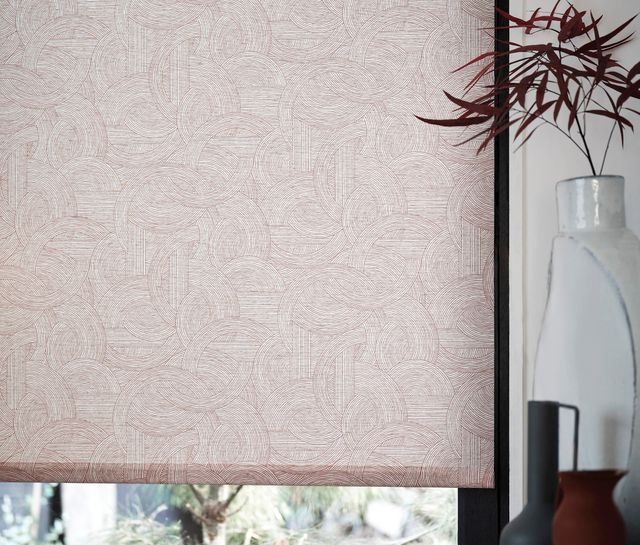 House Beautiful Breeze Russet Roller blind lifted slightly, allowing light into the room
