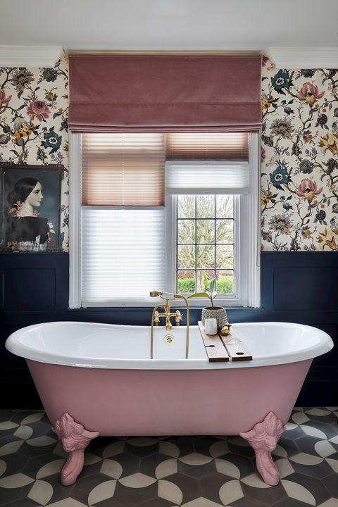 Rose pink, velvet roman blind over light, pleated blinds in a floral bathroom with rose pink and navy accents