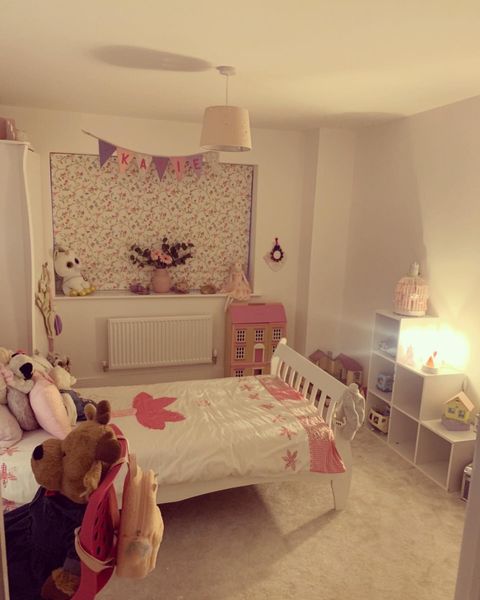Birdsong Roman blind in girl child's bedroom with pink accessories 
