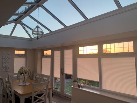 Crush Blush Pink Pleated blinds in a conservatory 