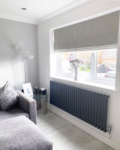 Katie Flynn's grey living room Roman blind with grey shaded accessories and furniture