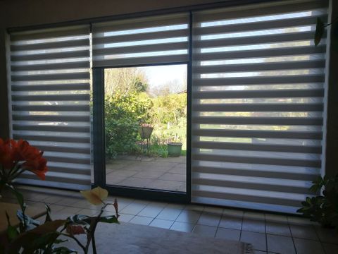 Local customer Christa Rushton's Day & Night blinds in large glass expanse