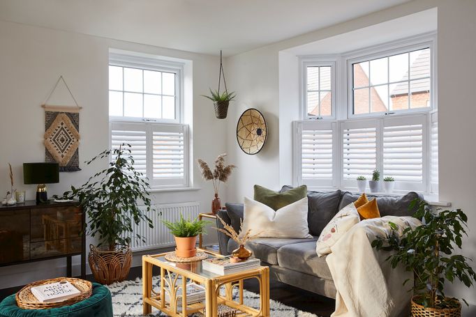 White cafe shutters in a cosy living room