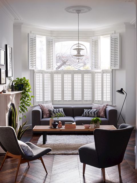 White tier on tier shutters in a modern living room
