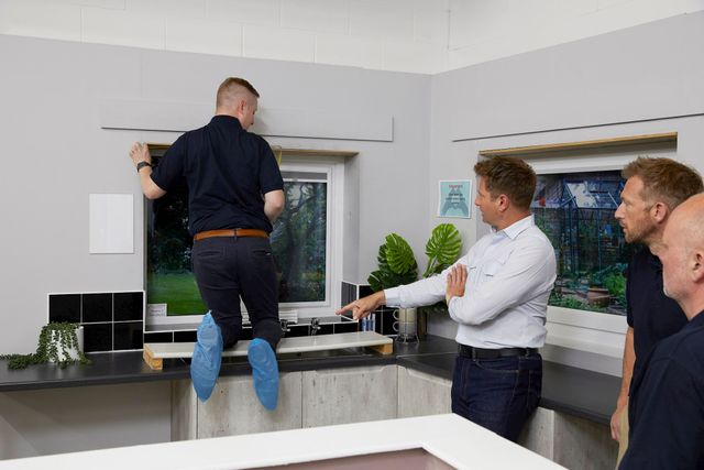 George Clarke and advisors demonstrating product fitting