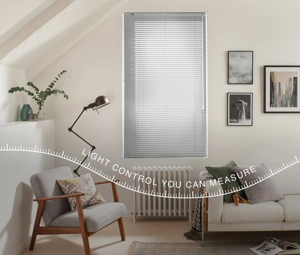 Venetian blind in living room window. Measuring tape device across the image with 'light control you can measure' text