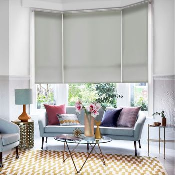 Hexham silver roller blind in 3 sided bay living room window