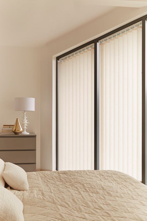 Stratford cream vertical blinds in bedroom
