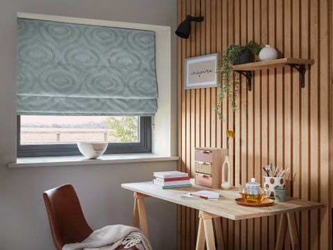 Tranquil Mineral roman blind in an office window 