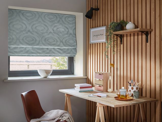 Tranquil Mineral roman blind in an office window 