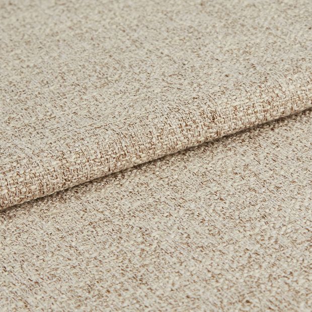 Nest almond swatch is a folded fabric in a beige shade made up of multiple layers of cream and brown woven together
