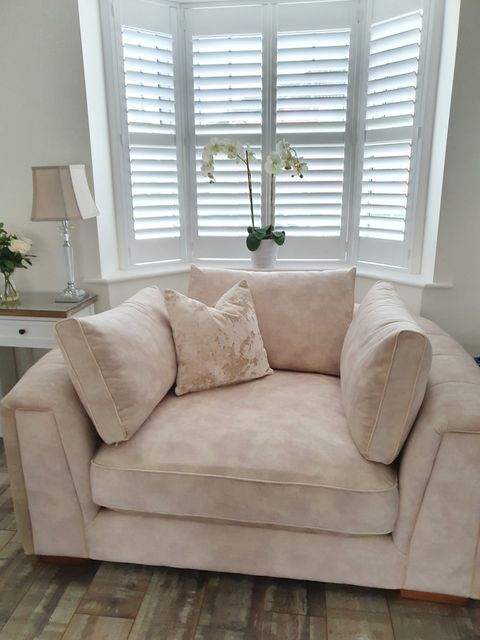 White Full Height Shutters in small living room bay window