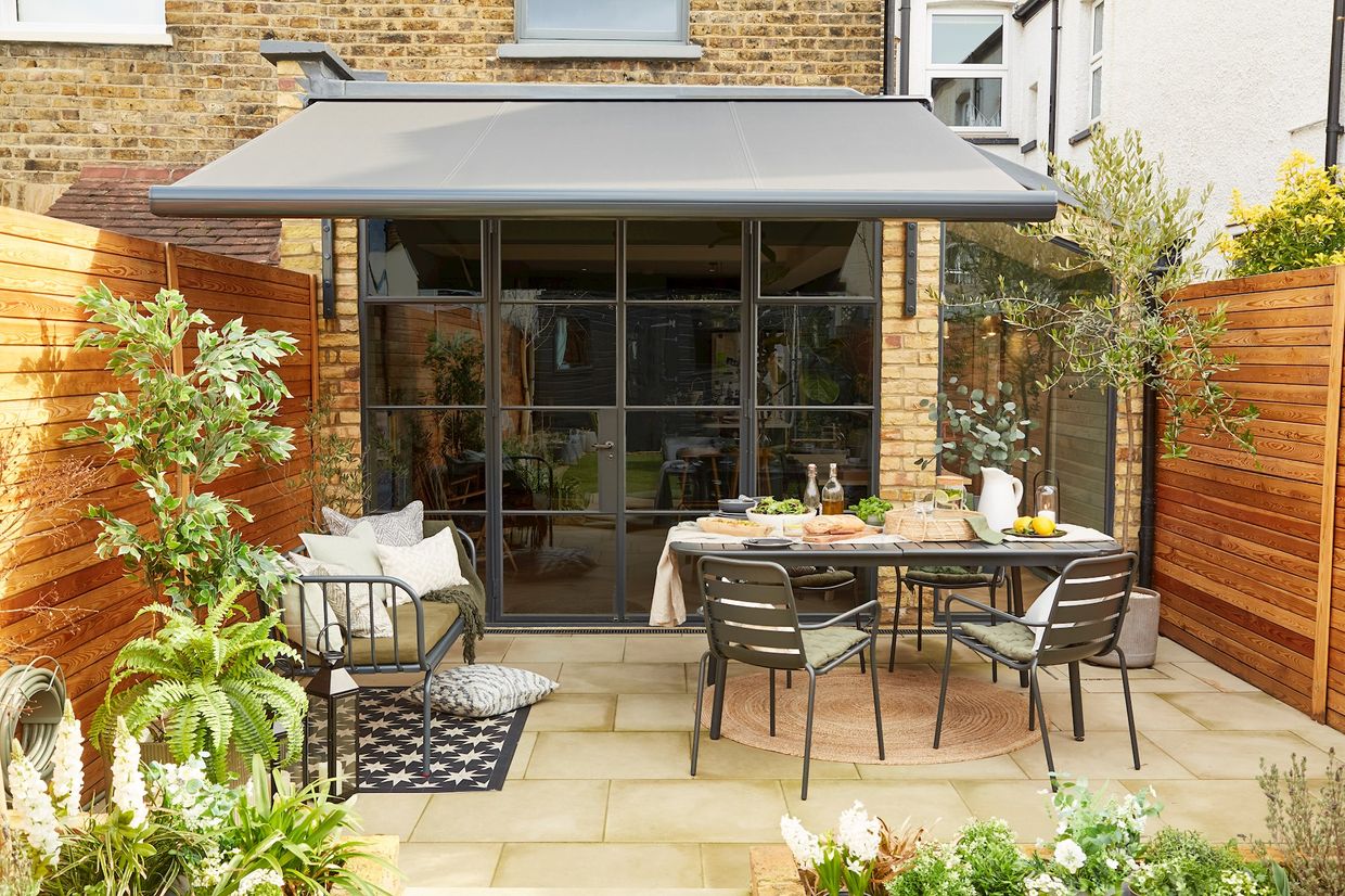 Hillarys awning, opened over a garden furniture 