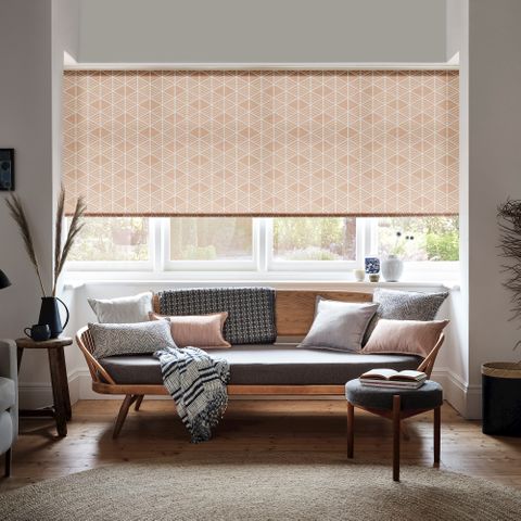 Warsaw Coral Roller blind in a lounge window