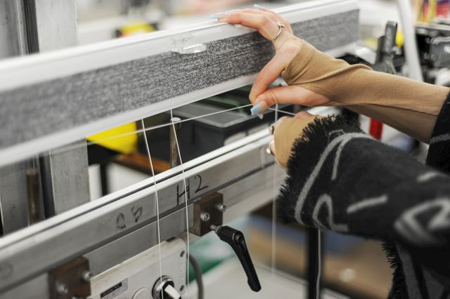 woman using a fabric machine