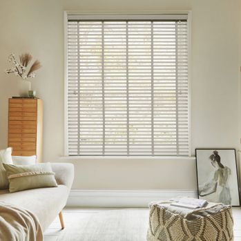 Zen moonshine faux wooden blind with light grey tapes in large bedroom window