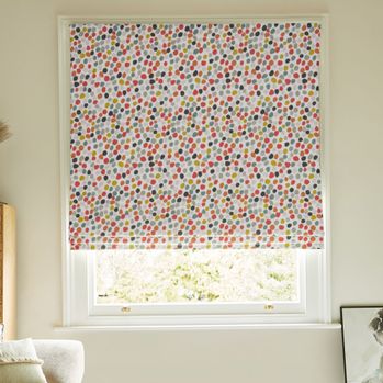 Tutti Frutti Bon Bon roman blind giving a pop of colour in neutral bedroom window