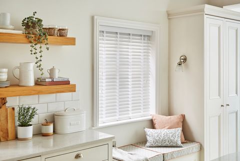 Natural glacier Bamboo blinds with white tape in a white kitchen 