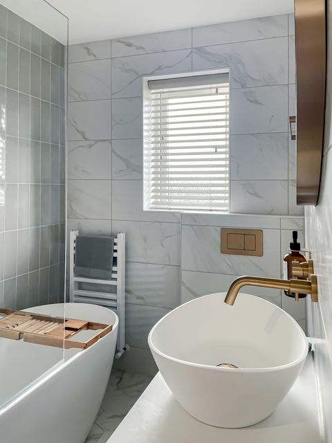 Zen Moonshine Wood Venetian blind in a marble white bathroom with a bath and sink 