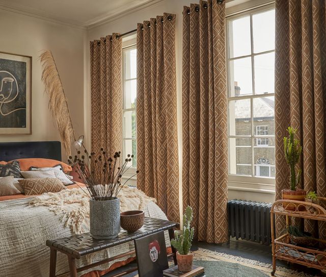 eyelet curtains in oriel sepia in modern rustic bedroom setting
