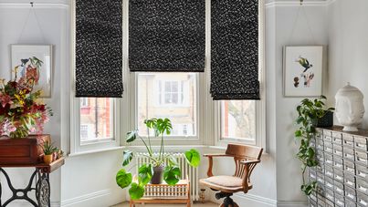 Set of three vapour obsidian roman blinds on living room bay window
