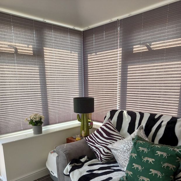 Crush charcoal pleated blinds in conservatory