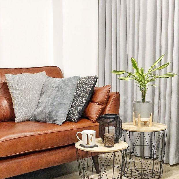 Huxley dove grey curtains in living room with brown sofa