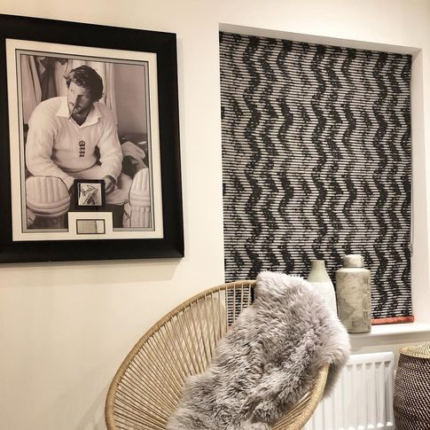 Cadillac noir roman blinds in contemporary cosy living room