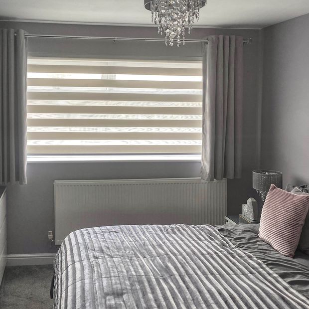 Dusk beige day and night dimout blinds in cosy bedroom