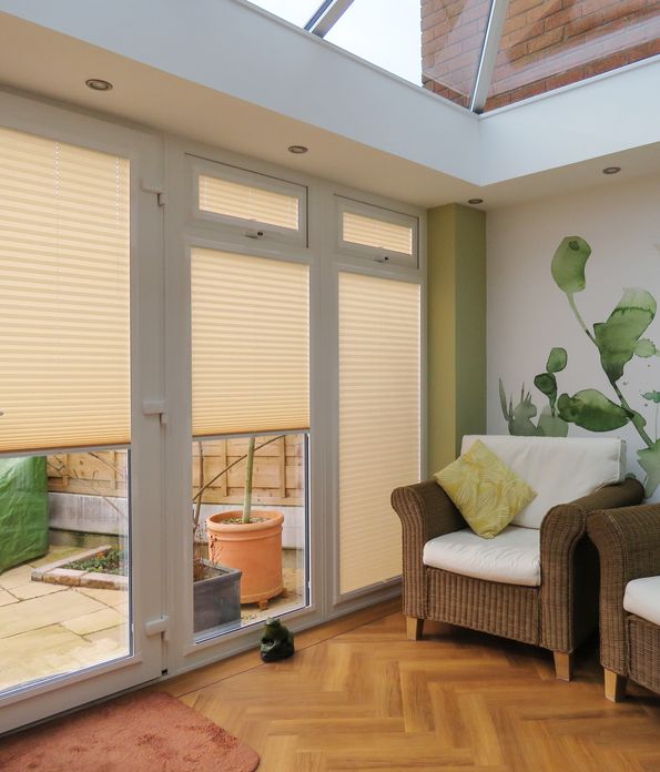 INTU micro infusion beige pleated blinds in conservatory